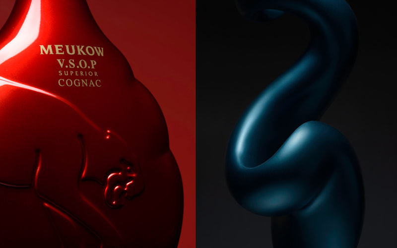 A pair of images with the left one being a red curvaceous bottle of cognac in front of a red paper and on the right is an image of a blue liquid-like sculpture.
